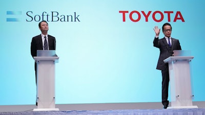 Junichi Miyakawa, left, Representative Director and CTO of SoftBank Corp. and Shigeki Tomoyama, right, Executive Vice President of Toyota Motor Corporation attend during a joint press conference in Tokyo Thursday, Oct. 4, 2018. Japan's No. 1 automaker Toyota Motor Corp. and technology giant SoftBank Group Corp. say they are setting up a joint venture to create mobility services.