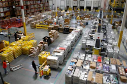 n this Aug. 3, 2017, file photo, workers prepare to move products at an Amazon fulfillment center in Baltimore. Amazon’s announcement Tuesday, Oct. 2, 2018, that it will raise its minimum wage to $15 an hour will intensify the pressure on other companies to also lift their pay levels, particularly retailers and warehouse operators that are looking to staff up for the holidays.