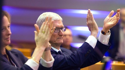 Apple CEO Tim Cook applauds during a data privacy conference at the European Parliament in Brussels, Wednesday, Oct. 24, 2018.