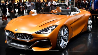In this Tuesday, Sept. 12, 2017 file photo, Visitors surround a BMW Z4 Concept during the first media day of the International Frankfurt Motor Show IAA in Frankfurt, Germany. Doubts about diesel, Brexit, trade worries, tighter emissions controls. Those are the challenges that will be on the minds of auto executives when they gather this week ahead of the Paris Motor Show, starting with off-site events Monday, Oct. 1 followed by two days of vehicle unveilings and news conferences at the pavilion before the show opens to the public from Oct. 4 to Oct. 14. Both BMW and Daimler cited trade concerns in issuing profit warnings this year. BMW is the largest U.S. auto exporter, shipping SUVs from its plant in Spartanburg, South Carolina. So when China imposed tariffs on U.S. cars, it took a hit.