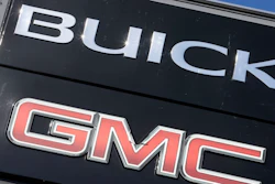 In this April 25, 2017, file photo, a General Motors dealer's sign stands in Nashville, Tenn. U.S. auto companies such as General Motors, Tesla and Ford faltered this year in Consumer Reports' reliability rankings as readers reported more mechanical trouble and fewer problems with infotainment systems.