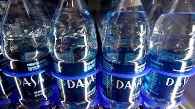 In this Dec. 9, 2009, file photo, Dasani bottled water owned by Coca-Cola sits on the shelf in Montpelier, Vt. Strong sales of water and sugar-free drinks powered third-quarter earnings for Coca-Cola Co reported Tuesday, Oct. 30, 2018.