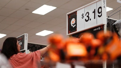 In this Oct. 3, 2018, file photo a customer shops at a Target department store in Pembroke Pines, Fla. On Monday, Oct. 15, the Commerce Department releases U.S. retail sales data for September.