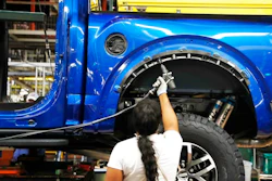 In this Sept. 27, 2018, file photo a United Auto Workers assemblyman works on a 2018 Ford F-150 truck being assembled at the Ford Rouge assembly plant in Dearborn, Mich. Ford Motor Co. reports earnings Wednesday, Oct. 24.