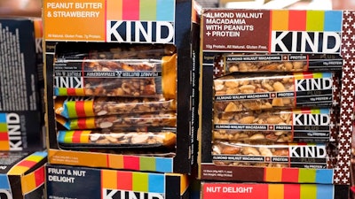 This Feb. 9, 2017, file photo shows Kind snack bars on display at a supermarket in New York. The government’s definition of healthy came under scrutiny in late 2015, when the FDA warned Kind that its snack bars had too much fat to use the term. Kind pushed back, saying the fat came from nuts.