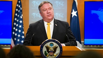 In this Wednesday, Oct. 3, 2018 file photo, Secretary of State Mike Pompeo briefs reporters at the State Department in Washington. No international letters, no international packages: A top official with a 192-country postal union says that's what Americans can expect if the Trump administration goes through with plans to pull of an international postal treaty over concerns about China. Pascal Clivaz, deputy director-general of the Switzerland-based Universal Postal Union, said on Friday, Oct. 19 the agency reached out quickly to U.S. officials after receiving a letter from U.S. Secretary of State Mike Pompeo this week announcing Washington's plan to pull out of the union in a year if the treaty isn't renegotiated.