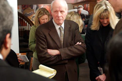 In this Tuesday, Feb. 1, 2005, file photo, William 'Bill' Coors, center, talks about the merger between Molson and Coors after a news conference at the Coors Brewery in Golden, Colo. Molson Coors Brewing Co. said that William 'Bill' Coors, the former chairman of Adolph Coors Co. and grandson of the brewing company's founder, died Saturday, Oct. 13, 2018, at age 102.