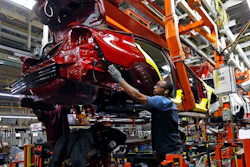 In this Sept. 27, 2018, file photo line technicians work on assembling a redesigned Nissan Altima sedan at its Nissan Canton Vehicle Assembly Plant in Canton, Miss. On Tuesday, Oct. 16, the Federal Reserve reports on U.S. industrial production for September.