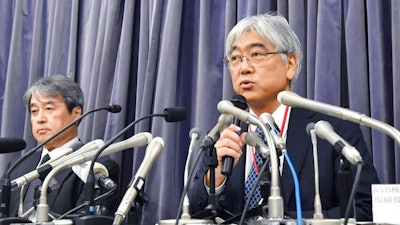 KYB Corp. Senior Managing Executive Officer Keisuke Saito, right, and its affiliated firm Kayaba System Machinery Co., Ltd. President Shigeki Hirokado attend a press conference in Tokyo Friday, Oct. 19, 2018. The Japanese government has ordered the company that falsified quality data for earthquake 'shock absorbers' used in hundreds of buildings to speed up an investigation and fix any problems quickly.