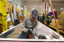 In this Thursday, Oct. 18, 2018, photo Luis Ramos works at the Howard McCray's commercial refrigeration manufacturing facility in Philadelphia. The experience Christopher Scott, president of Howard McCray, has had suggests that the impact of the tariffs is still playing out. Though has absorbed the higher costs for now, he hopes to eventually pass some on to his customers. First, though, he wants to see how his larger competitors handle the higher costs. “Little Howard McCray can’t go out and raise prices 10 percent and lose all the market share that we’ve worked so hard to gain,” Scott said.