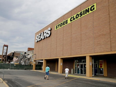 n this July 8, 2017, file photo people walk into a Sears store slated for closing that is next to a mall that is being torn down in Overland Park, Kan. Sears has filed for Chapter 11 bankruptcy protection Monday, Oct. 15, 2018, buckling under its massive debt load and staggering losses. The company once dominated the American landscape, but whether a smaller Sears can be viable remains in question.