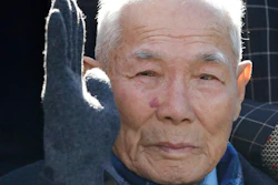 South Korean Lee Chun-sik, a 94-year-old victim of forced labor during Japan's colonial rule of the Korean Peninsula before the end of World War II, gestures upon his arrival at the Supreme Court in Seoul, South Korea, Tuesday, Oct. 30, 2018. In a potentially far-reaching decision, South Korea's Supreme Court ruled that a Japanese steelmaker should compensate four South Koreans for forced labor during Japan's colonial rule of the Korean Peninsula before the end of World War II.