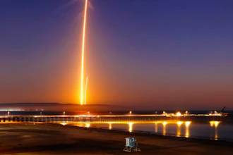 Two streaks in this long exposure photo show a SpaceX Falcon 9 rocket lifting off, left, from Vandenberg Air Force Base, as seen from Pismo Beach, Calif. Sunday, Oct. 7, 2018, and then its first stage returning, right, to Earth at a nearby landing pad. The primary purpose of the mission was to place the SAOCOM 1A satellite into orbit, but SpaceX also wanted to expand its recovery of first stages to its launch site at the Air Force base, about 130 miles (209 kilometers) northwest of Los Angeles.
