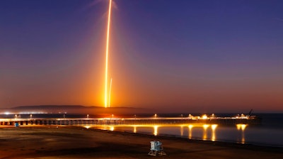 Two streaks in this long exposure photo show a SpaceX Falcon 9 rocket lifting off, left, from Vandenberg Air Force Base, as seen from Pismo Beach, Calif. Sunday, Oct. 7, 2018, and then its first stage returning, right, to Earth at a nearby landing pad. The primary purpose of the mission was to place the SAOCOM 1A satellite into orbit, but SpaceX also wanted to expand its recovery of first stages to its launch site at the Air Force base, about 130 miles (209 kilometers) northwest of Los Angeles.