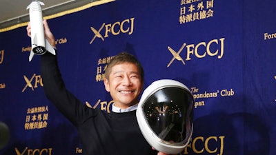 Zozo Chief Executive Yusaku Maezawa poses for the media prior to his news conference in Tokyo, Tuesday, Oct. 9, 2018. The Japanese online retail tycoon who plans to travel to the moon on the SpaceX rocket says he respects and trusts Elon Musk as a fellow entrepreneur, despite his recent troubles.