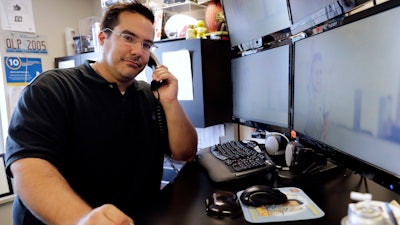 In this Sept. 20, 2018, photo Bret Bonnet of Quality Logo Products poses for a photo at his office in Aurora, Ill. Bonnet was ghosted on what would have been an employee’s first day of work, just hours after the would-be staffer texted him. “To this day we have never heard from him. I'm not sure why anyone would invest so much of their own time/effort only to ghost us at the last minute,” Bonnet says.