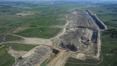 This file photo taken May 25, 2013, shows an aerial view of Colstrip power plants 1,2,3 & 4 and the Westmoreland coal mines near Colstrip, Mont. Westmoreland Coal Co. of Englewood, Colo., filed for bankruptcy Tuesday, Oct. 9, 2018, to deal with steep debt and declining world demand.