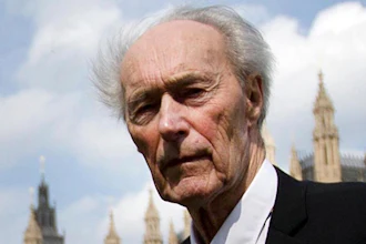 In this Thursday, April 25, 2013 file photo, Norwegian war hero and resistance fighter Joachim Roenneberg holds a Union flag as he walks in a park near the Palace of Westminster, after receiving the Union Jack Medal for his efforts and cooperation with the British during the second World War. Norway's leader says World War II saboteur Roenneberg has died at 99, it was reported on Monday, Oct. 22, 2018. In 1943, Roenneberg headed the four-man team that blew up a plant producing heavy water, which Nazi Germany could have used to produce nuclear weapons.