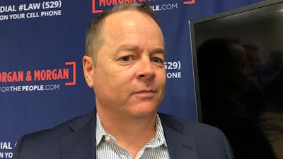 Shawn Hudson stands in his lawyers office after filing a lawsuit against Tesla on Tuesday, Oct. 30 in Orlando, Fla. The lawsuit says the autopilot feature of his Tesla Model S failed to detect a disabled car on a highway, leading to a collision that left him with permanent injuries.