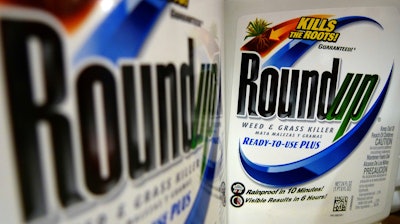 In this June 28, 2011, file photo, bottles of Roundup herbicide, a product of Monsanto, are displayed on a store shelf in St. Louis. German drug and chemicals company Bayer AG announced Monday, May 23, 2016, that it has made a $62 billion offer to buy U.S.-based crops and seeds specialist Monsanto. A Northern California judge has upheld a jury's verdict finding Monsanto's weed killer caused a groundskeeper's cancer, but slashed his $287 million award to $78 million. San Francisco Superior Court Judge Suzanne Bolanos ruled Monday, Oct. 22.