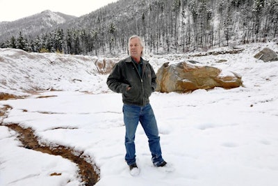 In this Oct. 11, 2018 photo, Paule Antonioli, an independent miner from Butte, stands among tailing piles at his Mammoth Mine south of Cardwell, Mont. in the Tobacco Root Mountains. Through a program that began in 2011, Barrick Gold Corp.-owned Golden Sunlight has paid out more than $45 million to small miners in the last seven years, company officials say. All of it has been for gold dug out of old mine dumps.