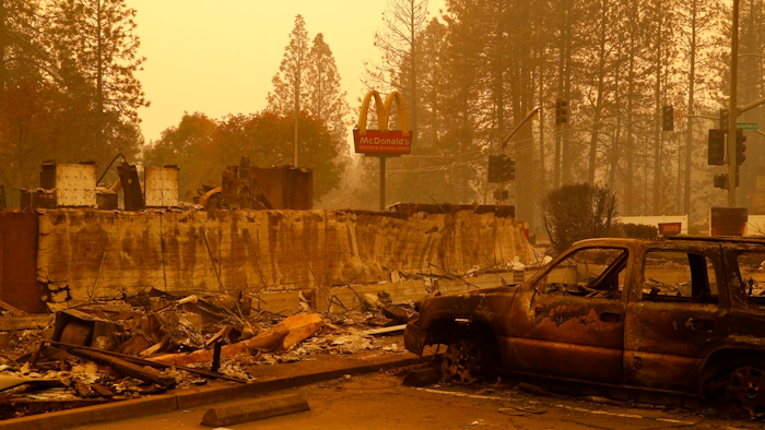 A sign still stands at a McDonald's restaurant burned in the Camp Fire, Monday, Nov. 12, 2018, in the northern California town of Paradise.