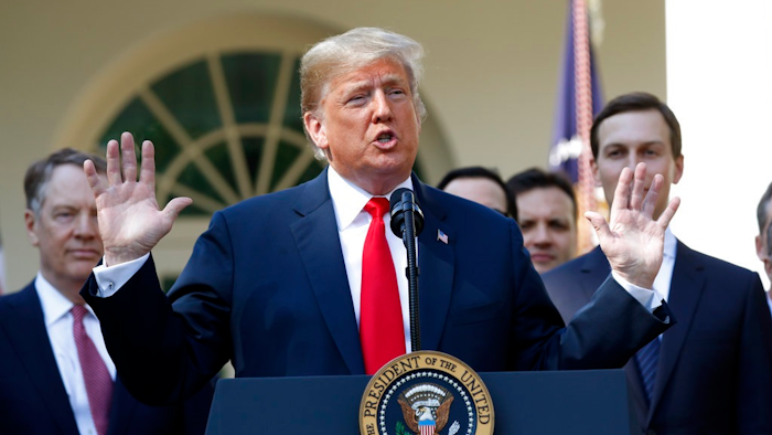 In this Monday, Oct. 1, 2018 file photo, President Donald Trump speaks as he announces a revamped North American free trade deal, in the Rose Garden of the White House in Washington. President Donald Trump insists his new North American trade deal will deliver a victory for U.S. factory workers by returning many high-paying jobs to the United States. Maybe. But a review of the agreement suggests that job gains for the U.S. would likely mean higher prices for consumers and more inefficiencies for businesses. The biggest winners might end up being robots and the companies that make them.