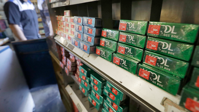 This May 17, 2018 file photo shows packs of menthol cigarettes and other tobacco products at a store in San Francisco. On Thursday, May 15, 2018, FDA Commissioner Dr. Scott Gottlieb pledged to ban menthol from cigarettes, in what could be a major step to further push down U.S. smoking rates.