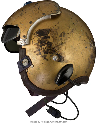 This undated photo provided by Heritage Auctions shows a helmet worn by John Glenn during the history-making flight, dubbed Project Bullet, in which the future astronaut set the transcontinental speed record in 1957. Artifacts owned by the late Neil Armstrong will be offered for sale by Dallas-based Heritage Auctions starting Thursday, Nov. 1, 2018, including pieces of a wing and propeller from the 1903 Wright Flyer the astronaut took with him to the moon in 1969.