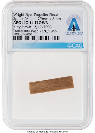 This undated photo provided by the Dallas-based Heritage Auctions shows a fragment from the propeller from the Wright brothers’ Flyer. Memorabilia that belonged to the first man to set foot on the moon, Neil Armstrong, has fetched more than $7.4 million at auction.