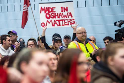 Workers of Oshawa's General Motors car assembly plant, listen to Jerry Dias, president of UNIFOR, the union representing the workers, at the union headquarters, in Oshawa, Ont. on Monday, Nov. 26, 2018.