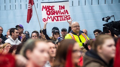 Workers of Oshawa's General Motors car assembly plant, listen to Jerry Dias, president of UNIFOR, the union representing the workers, at the union headquarters, in Oshawa, Ont. on Monday, Nov. 26, 2018.