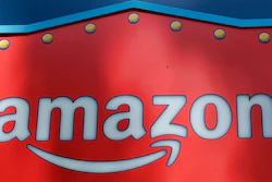 his Oct. 23, 2018, file photo shows an Amazon logo atop the Amazon Treasure Truck The Park DTLA office complex in downtown Los Angeles. Amazon launched a program Thursday, Nov. 1, that aims to teach more than 10 million students a year how to code.