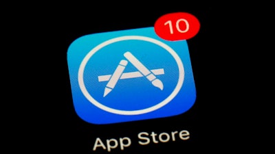 This March 19, 2018, file photo shows Apple's App Store app in Baltimore. Apple is at the Supreme Court to defend the way it sells apps for iPhones against claims by consumers that the company has unfairly monopolized the market. The justices are hearing arguments Monday, Nov. 26, in Apple’s effort to end an antitrust lawsuit that could force the iPhone maker to cut the 30 percent commission it charges software developers whose apps are sold exclusively through Apple’s App Store.