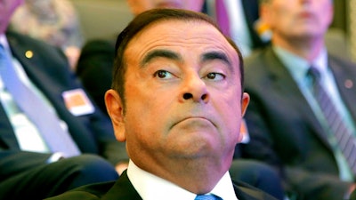 In this Oct. 6, 2017, file photo, former Nissan Motor chariman Carlos Ghosn attend a media conference outside Paris, France. Japanese prosecutors said Thursday they will detain former Nissan Motor chairman Carlos Ghosn for as long as needed to finish their investigation into suspicions of financial irregularities, as meanwhile the Renault-Nissan-Mitsubishi alliance reaffirmed its partnership.