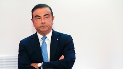 In this Oct. 6, 2017, file photo, Renault and Nissan Motor Co.'s chairman Carlos Ghosn listens during a media conference outside Paris, France. Nissan Motor Co. says an internal investigation found that its chairman, Carlos Ghosn, has underreported his income. The auto company said he will be dismissed.