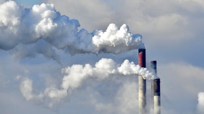 In this Feb. 27, 2018 file photo a coal-fired power station steams in the cold winter air in Gelsenkirchen, Germany. Environmental groups say 10 utility companies are responsible for the majority of premature deaths caused by emissions from coal-fired power plants in Europe. In a report published Tuesday, Nov. 20, 2018 five campaign groups, including Greenpeace, blame the companies for 7,600 premature deaths and millions of work days lost across Europe in 2016.