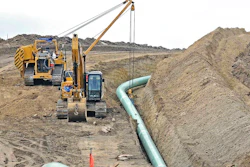 In this Oct. 5, 2016, file photo, heavy equipment is seen at a site where sections of the Dakota Access pipeline were being buried near the town of St. Anthony in Morton County, N.D. The Standing Rock Sioux is challenging new government conclusions that the $3.8 billion Dakota Access oil pipeline poses no significant environmental threats to American Indian tribes in the Dakotas. The Army Corps of Engineers in August finished more than a year of additional study ordered by a federal judge.