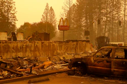 A sign still stands at a McDonald's restaurant burned in the Camp Fire, Monday, Nov. 12, 2018, in the northern California town of Paradise.