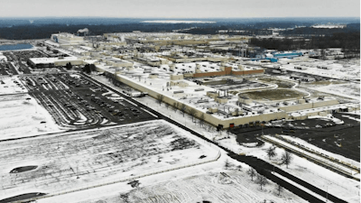Snow covers the perimeter of the General Motors' Lordstown plant, Wednesday, Nov. 28, 2018, in Warren, Ohio. Even though unemployment is low, the economy is growing and U.S. auto sales are near historic highs, GM is cutting thousands of jobs in a major restructuring aimed at generating cash to spend on innovation. GM put five plants up for possible closure, including the plant in Lordstown.