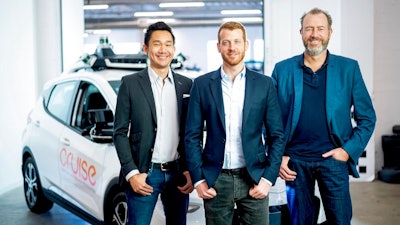 In this Nov. 20, 2018, photo provided by General Motors/Cruise, from left, Cruise Automation's Dan Kan and Kyle Vogt pose for a photo with General Motors' Dan Ammann at Cruise Automation offices in San Francisco, Calif. General Motors’ No. 2 executive is moving from Motor City to Silicon Valley to run the automaker’s self-driving car operations as it attempts to cash in on its bet that robotic vehicles will transform transportation. In a transition announced Thursday, Nov. 29, GM President Ammann will become CEO of the company’s Cruise Automation subsidiary at the beginning of next year. He will replace Cruise co-founder Vogt, who will become chief technology officer.
