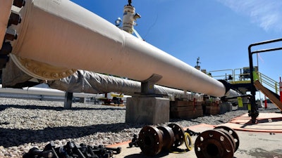 In this June 8, 2017, file photo, fresh nuts, bolts and fittings are ready to be added to the east leg of the pipeline near St. Ignace, Mich., as Enbridge prepares to test the east and west sides of the Line 5 pipeline under the Straits of Mackinac in Mackinaw City, Mich. Gov. Rick Snyder hopes to use the final weeks of his tenure to lock in a deal allowing construction of a hotly debated oil pipeline tunnel beneath a channel linking two of the Great Lakes.
