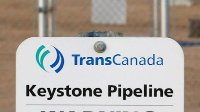 This Nov. 6, 2015, file photo shows a sign for TransCanada's Keystone pipeline facilities in Hardisty, Alberta, A federal judge in Montana has blocked construction of the $8 billion Keystone XL Pipeline to allow more time to study the project's potential environmental impact. U.S. District Judge Brian Morris' order on Thursday, Nov. 8, 2018 came as Calgary-based TransCanada was preparing to build the first stages of the oil pipeline in northern Montana. Environmental groups had sued TransCanada and The U.S. Department of State in federal court in Great Falls.