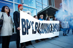 Activists from ProgressNow Colorado, grassroots organizations and stakeholders join forces to demonstrate outside the United States headquarters of BP, Wednesday, Nov. 14, 2018, in Denver. Meanwhile, only blocks to the east, the U.S. Environmental Protection Agency holds its only public hearing on the Trump administration's plans to roll back Obama-era rules for methane pollution from the oil and gas industry.