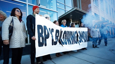 Activists from ProgressNow Colorado, grassroots organizations and stakeholders join forces to demonstrate outside the United States headquarters of BP, Wednesday, Nov. 14, 2018, in Denver. Meanwhile, only blocks to the east, the U.S. Environmental Protection Agency holds its only public hearing on the Trump administration's plans to roll back Obama-era rules for methane pollution from the oil and gas industry.