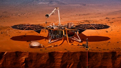 This illustration made available by NASA in 2018 shows the InSight lander drilling into the surface of Mars. InSight, short for Interior Exploration using Seismic Investigations, Geodesy and Heat Transport, is scheduled to arrive at the planet on Monday, Nov. 26, 2018.