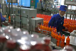 In this Oct. 22, 2018, photo, a worker monitors the production of bottled beverage at Songdowon General Foodstuffs Factory in Wonsan, North Korea. Though the international spotlight has been on his denuclearization talks with Washington, the North Korean leader has a lot riding domestically on his promises to boost the country's economy and standard of living. His announcement in April that North Korea had sufficiently developed its nuclear weapons and would now focus on building its economy marked a sharp turn in official policy and set the stage for his rapid-fire meetings with the leaders of China, South Korea and the United States.