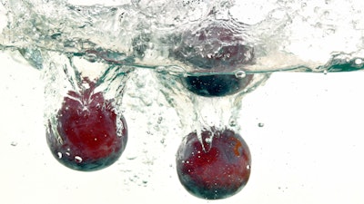 Plums Being Washed