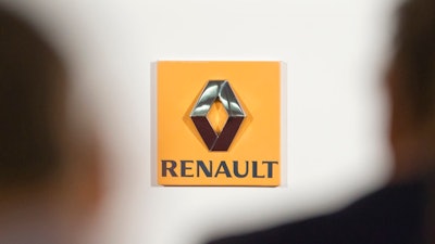 This Thursday Feb. 12, 2015 file picture shows the logo of French car maker Renault seen in a press conference held in Paris, France. France's finance minister wants carmaker Renault to replace its once-superstar CEO Carlos Ghosn while he faces accusations that he under-reported income at partner company Nissan.