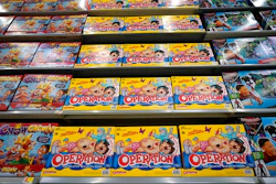 In this Nov. 9, 2018, file photo toys line the shelves in the expanded toy section at a Walmart Supercenter in Houston. Cozy sweaters and soft pajamas are in for adults. Kids, meanwhile, are asking for board games featuring fake poop and pimples.